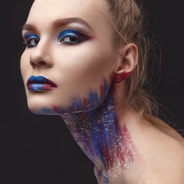 Portrait of beautiful girl with blue tones makeup