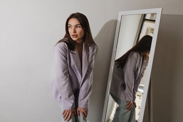 Portrait of a beautiful girl with dark hair in a purple jacket