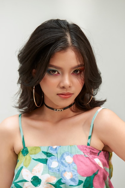 Portrait of beautiful girl with short hair in her hair and bright makeup