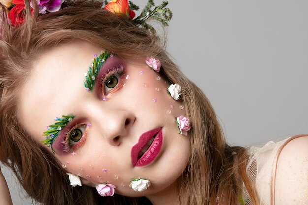 Portrait of a beautiful girl with unusual makeup