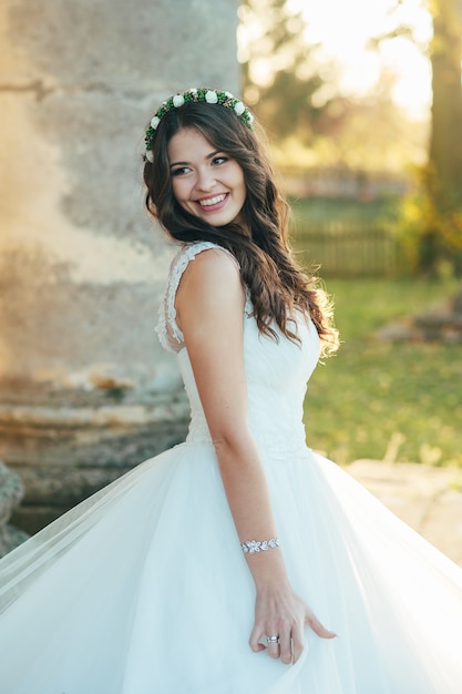 Portrait of a beautiful and happy bride in a wedding dress on her wedding day