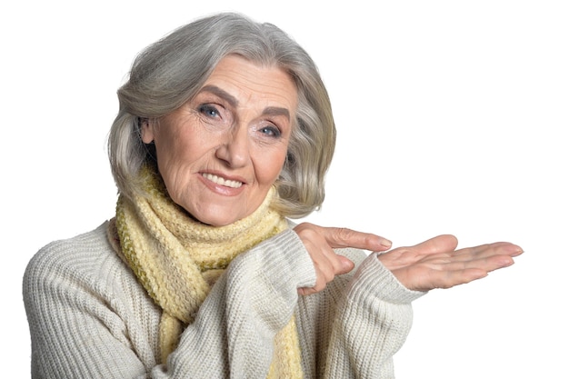 Portrait of a beautiful happy elderly woman on a white background