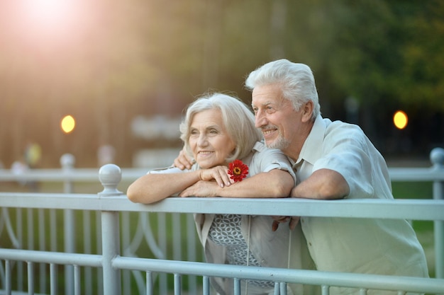 Portrait of beautiful happy senior couple in the park