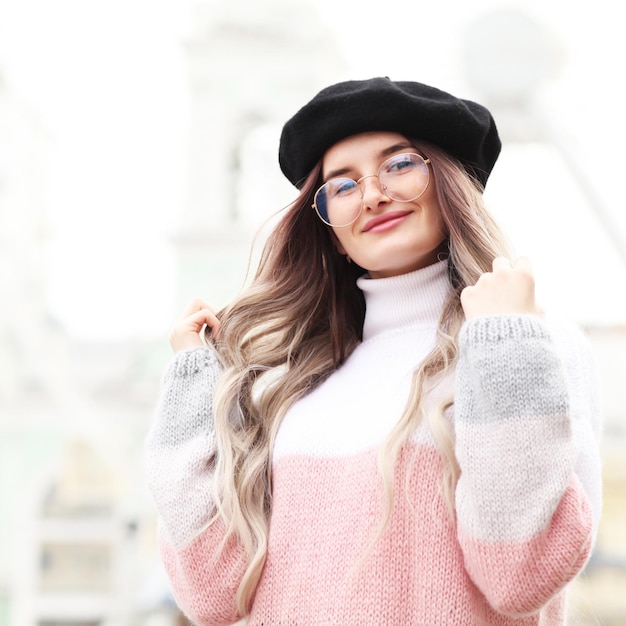 portrait of a beautiful happy smiling girl outdoors in winter