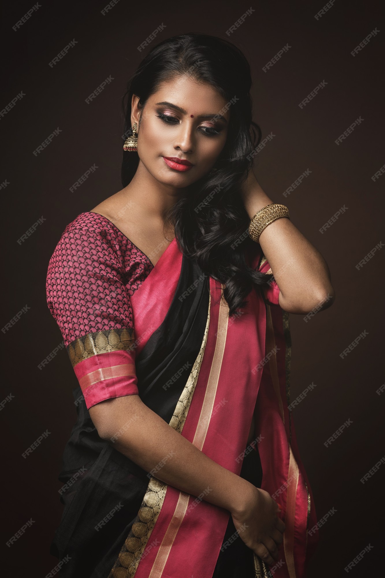 Premium Photo | Portrait of beautiful indian woman wearing traditional sari dress Premium Photo | Portrait of beautiful indian woman wearing traditional sari dress