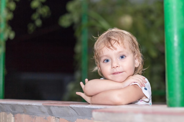 Portrait of a beautiful little baby girl on the night outdoors