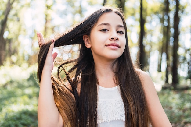 Portrait of a beautiful little girl in park 