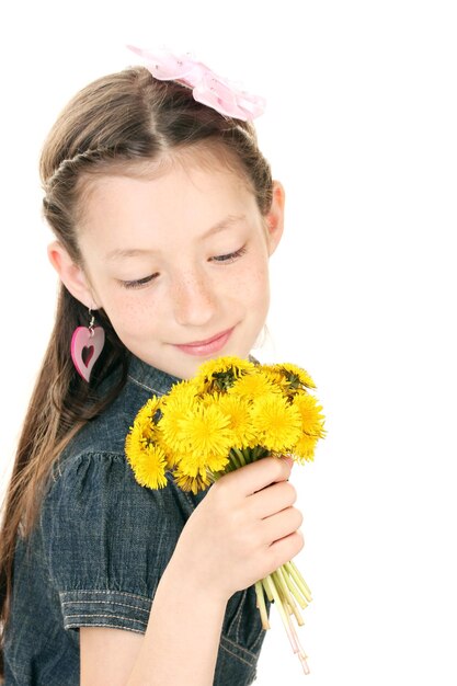 Portrait of beautiful little girl with dandelions isolated on white