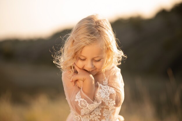 Portrait of a beautiful little princess girl in a pink dress, 