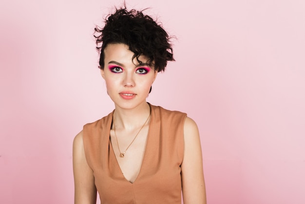 portrait of a beautiful model with bright pink make-up and bright flying hair. beautiful  makeup