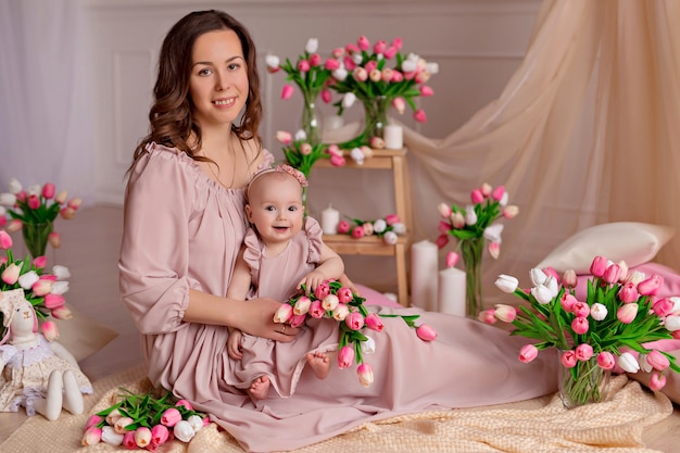 Portrait of a beautiful mom with a cute little daughter