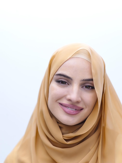 portrait of beautiful muslim woman in fashionable dress with hijab isolated on white background representing modern islam fashion and ramadan kareem concept