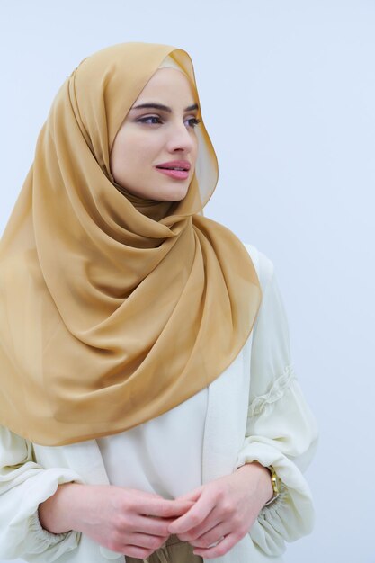 portrait of beautiful muslim woman in fashionable dress with hijab isolated on white background representing modern islam fashion and ramadan kareem concept