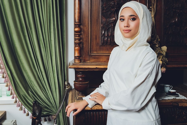 Portrait of a beautiful Muslim woman in traditional Islamic clothing and cover their heads