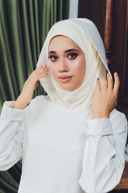 Portrait of a beautiful Muslim woman in traditional Islamic clothing and cover their heads