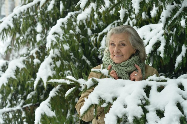 Portrait of a beautiful old woman in the winter