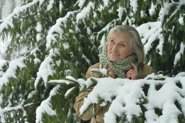 Portrait of a beautiful old woman in the winter