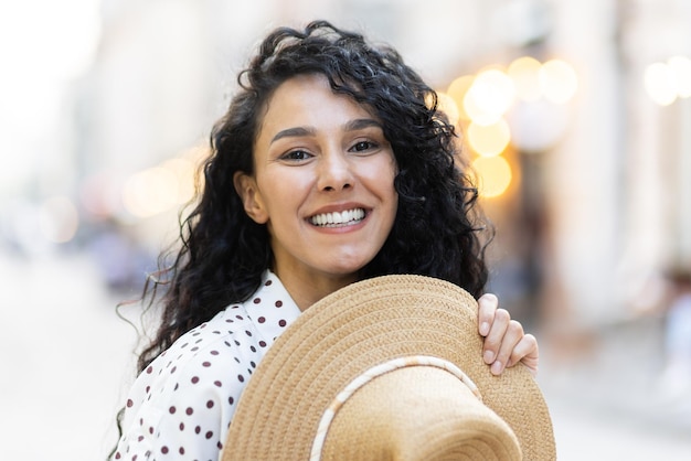 Portrait of a beautiful playful latin american woman a young tourist walking through the city in the