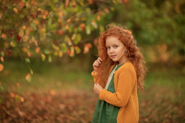 Portrait of a beautiful redhead girl with long hair