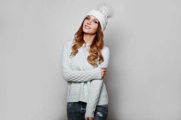 Portrait of beautiful redhead woman in sweater