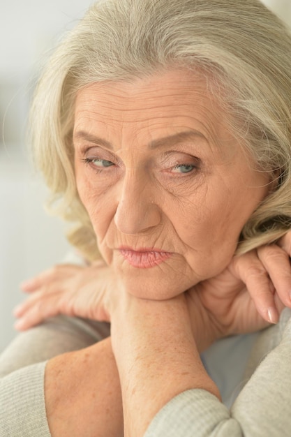 Portrait of a beautiful sad elderly woman closeup