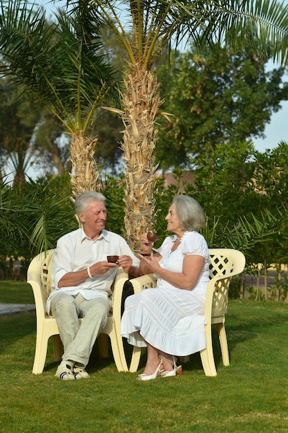 Portrait of beautiful senior couple drinking tea outside