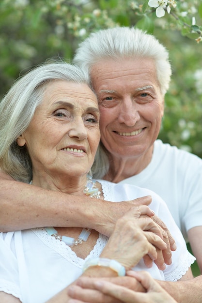 Portrait of beautiful senior couple posing in the park