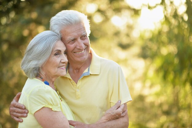 Portrait of beautiful senior couple relaxing in the spring park