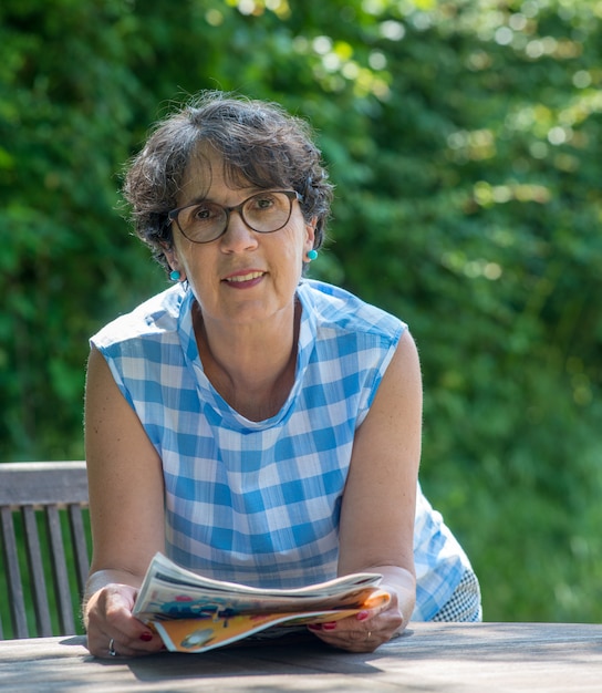 Portrait of a beautiful senior woman in the garden