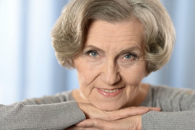 Portrait of beautiful senior woman at home