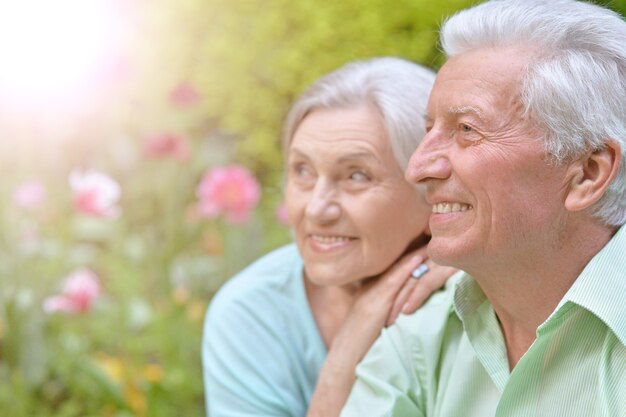 Portrait of beautiful senior woman outdoor in summer park