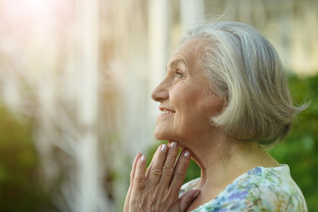 Portrait of a beautiful senior woman in the park