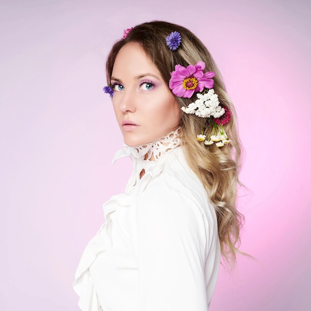 Portrait of a beautiful sensual woman with flowers