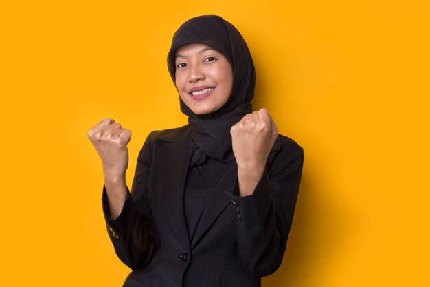 Portrait of a beautiful serious young Muslim woman wearing a black hijab