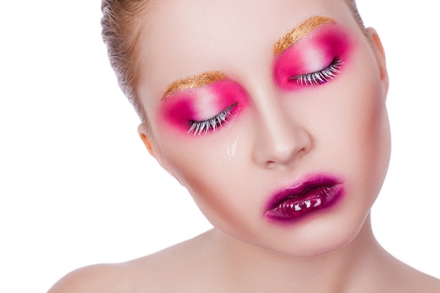 Photo portrait of a beautiful sexy girl with a creative makeup on white