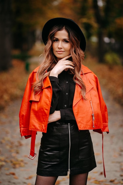 portrait of beautiful and sexy woman, woman in a red coat.