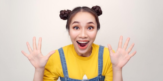 Portrait of beautiful surprised woman on white background