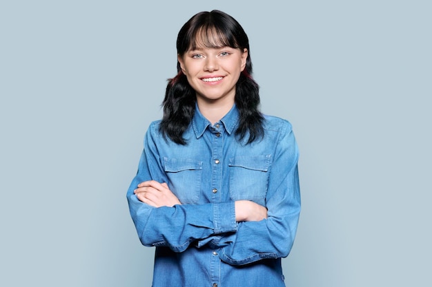 Portrait of beautiful teenage woman looking at the camera