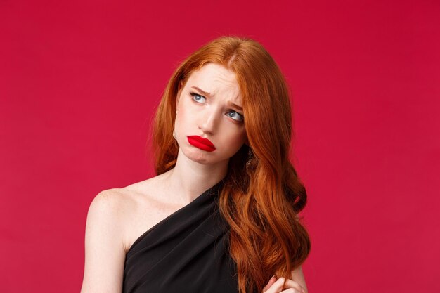 Portrait of a beautiful woman against red background