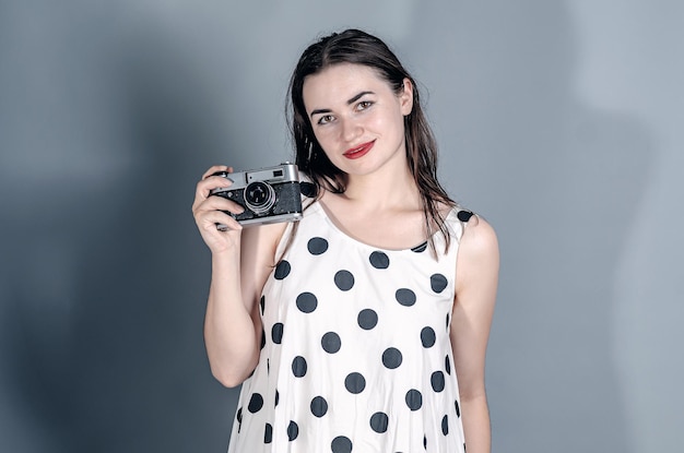 Portrait of a beautiful woman Dressed in a polka dot dress Take a photo