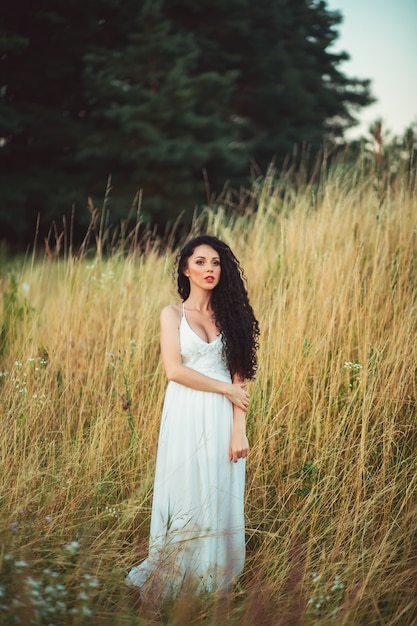 Portrait of beautiful woman in field