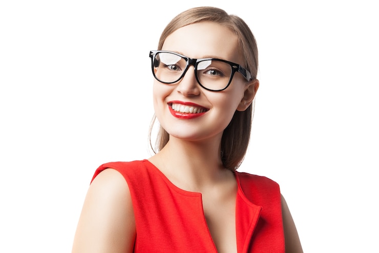Photo portrait of beautiful woman in glasses and red dress with red lipstick on looking at camera.isolated