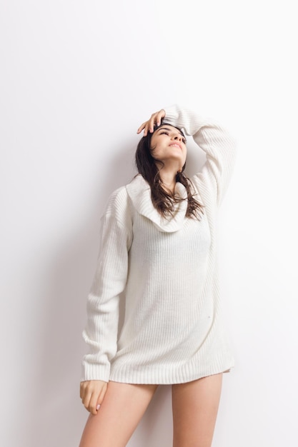 Portrait of beautiful woman isolated on white studio background comfort warm in winter concept