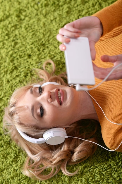 Portrait of beautiful woman listening to music