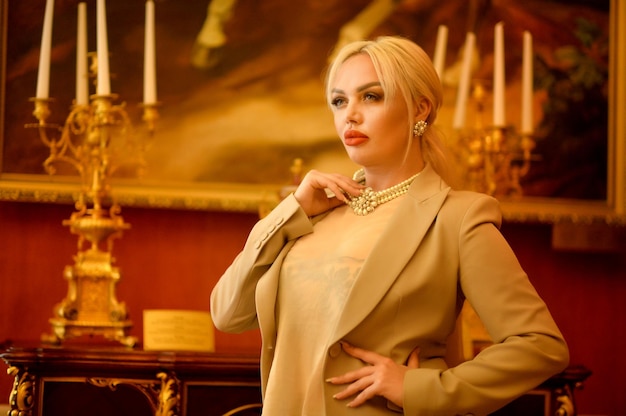 Portrait of a beautiful woman posing by clock