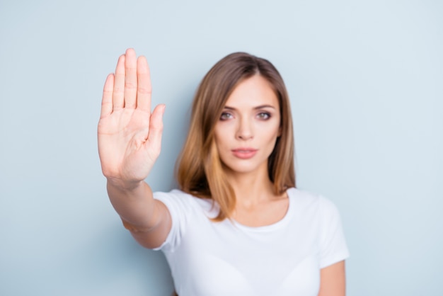 Portrait of beautiful woman saying stop