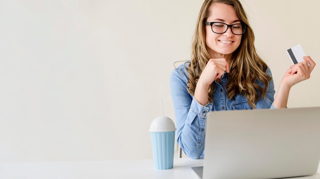 Portrait of beautiful woman shopping online