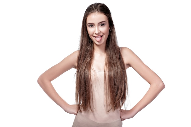 portrait of beautiful woman showing tongue isolated on white background.