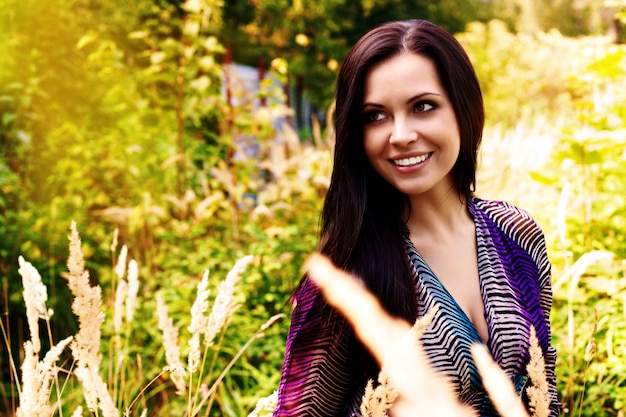 Portrait of a beautiful woman smiling outdoors