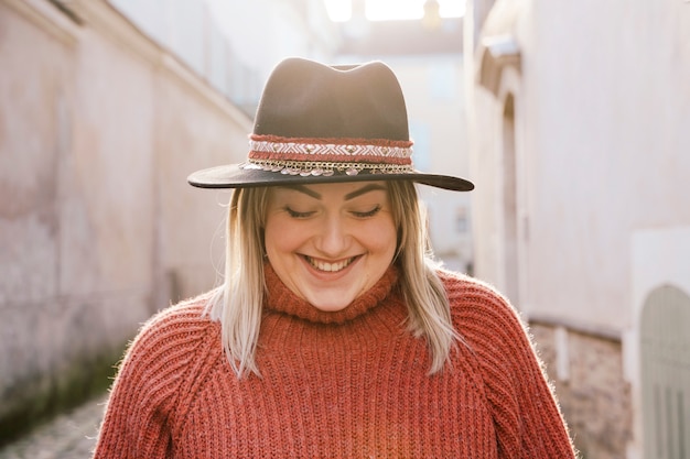 Portrait of beautiful woman standing in the street outdoors